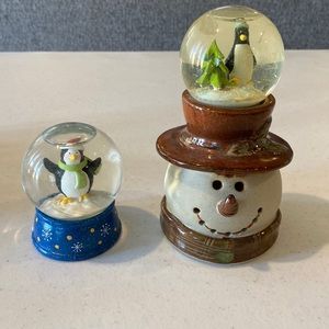Set of 2 penguin/ snowman mini snow globes. See sizes in pictures.